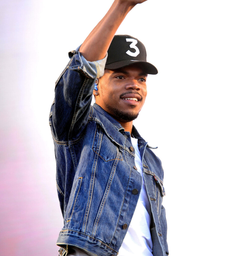 Chance The Rapper in black cap number 3 denim jacket smiling vibrant background wallpaper