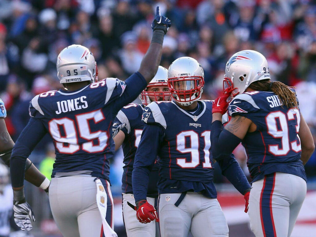 Chandler Jones 95 Wallpaper: Teamwork & Determination in Action