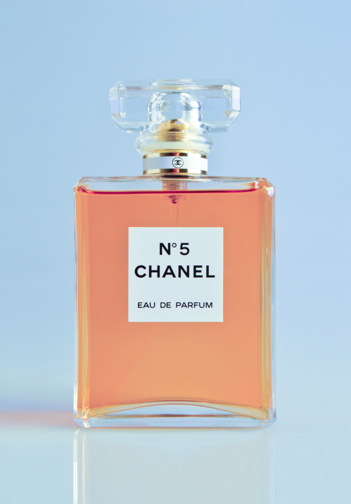 Chanel No 5 perfume bottle front view wallpaper elegant luxury iconic design background