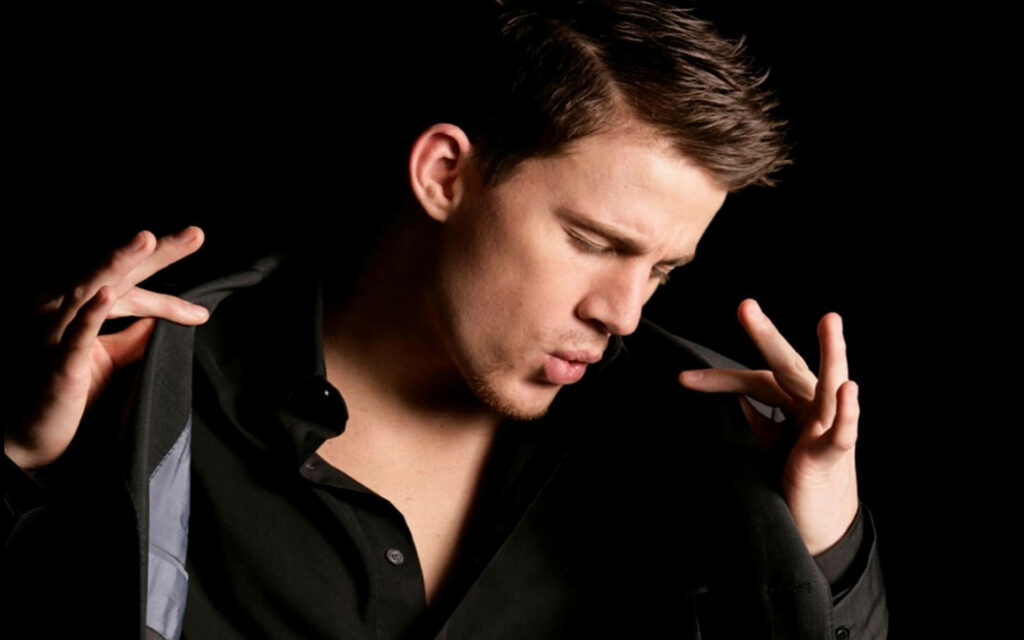 Channing Tatum in black shirt striking dramatic confident pose dark background wallpaper