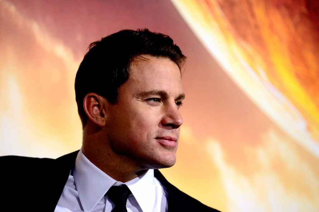 Channing Tatum sharp side profile vibrant glowing background dynamic charismatic wallpaper