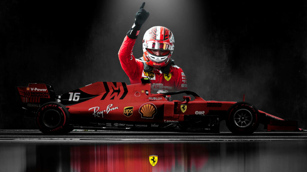 Ferrari's Rising Star: Leclerc's Commanding Gesture Captures the Essence of Speed Wallpaper