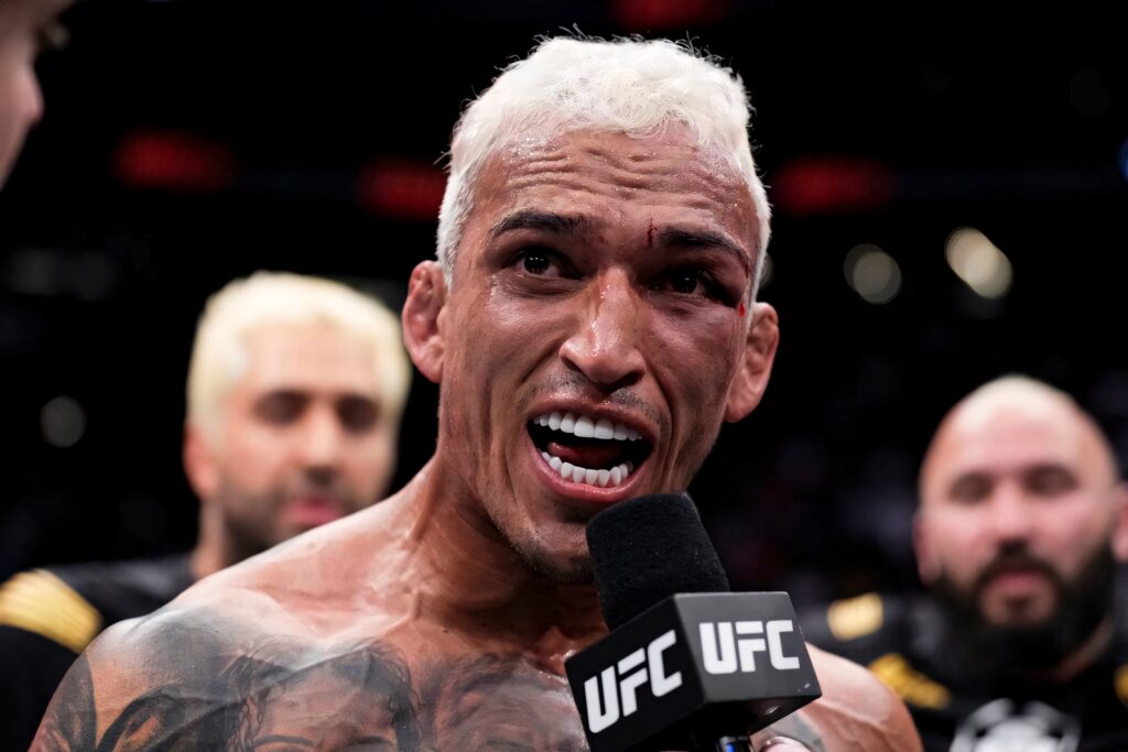 Charles Oliveira intense UFC interview close-up platinum blonde hair tattoos determined expression Wallpaper