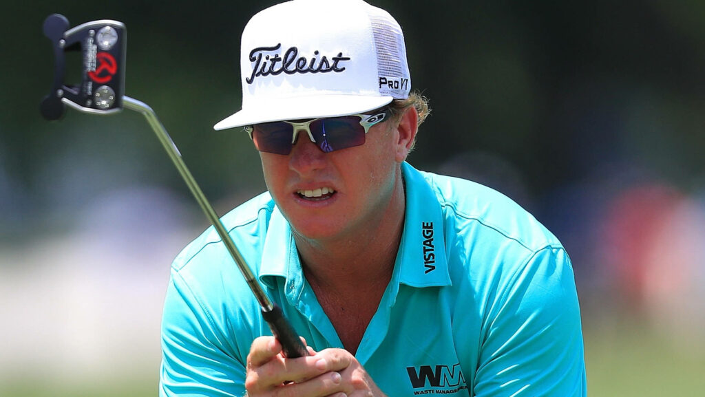 Charley Hoffman intensely focused gripping putter sweating vibrant aqua shirt golf course competitive energy Wallpaper