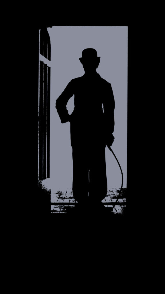 Charlie Chaplin silhouette in front of open door classic timeless iconic movie wallpaper background