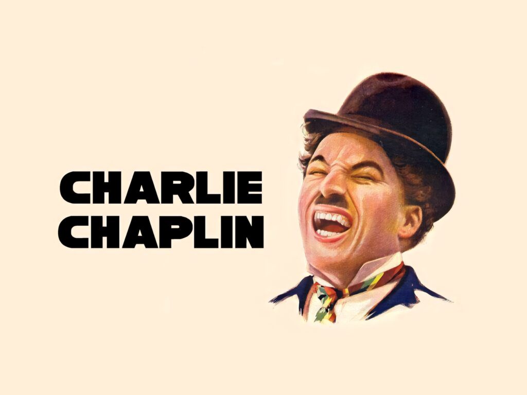Vibrant Charlie Chaplin portrait wallpaper featuring joyful expression and classic bowler hat