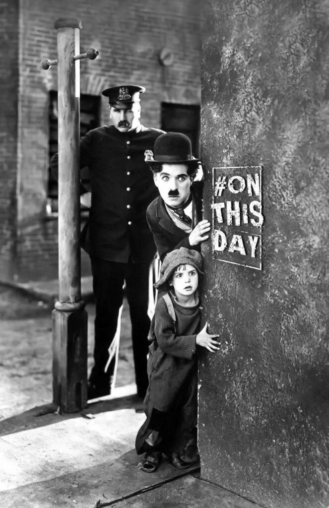 Charlie Chaplin and child peek around corner with stern policeman in classic cinema scene wallpaper