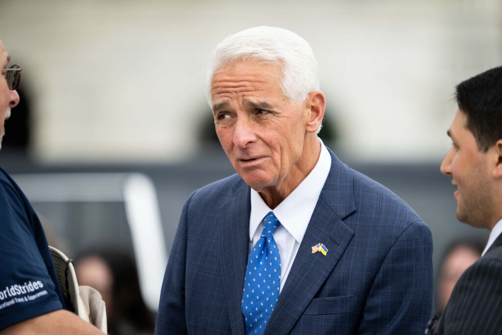 Charlie Crist Florida politician in blue plaid suit with thoughtful expression wallpaper background