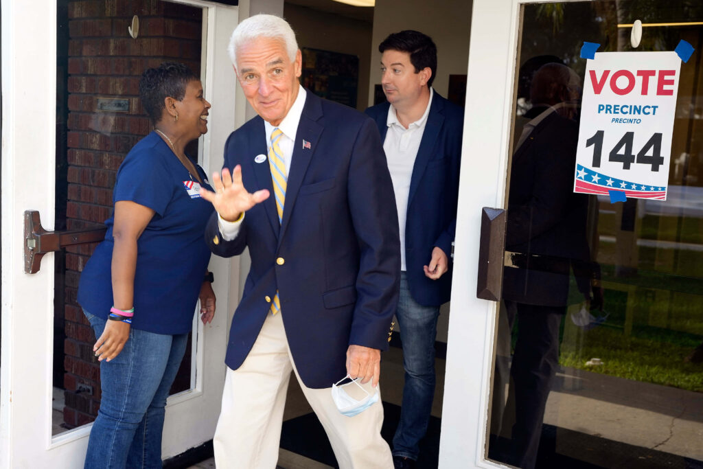 Charlie Crist smiling and waving outside polling place Vote Precinct 144 showing civic engagement Wallpaper