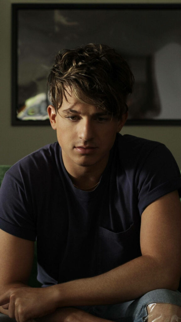 Charlie Puth thoughtful sad expression portrait in soft moody light wallpaper background