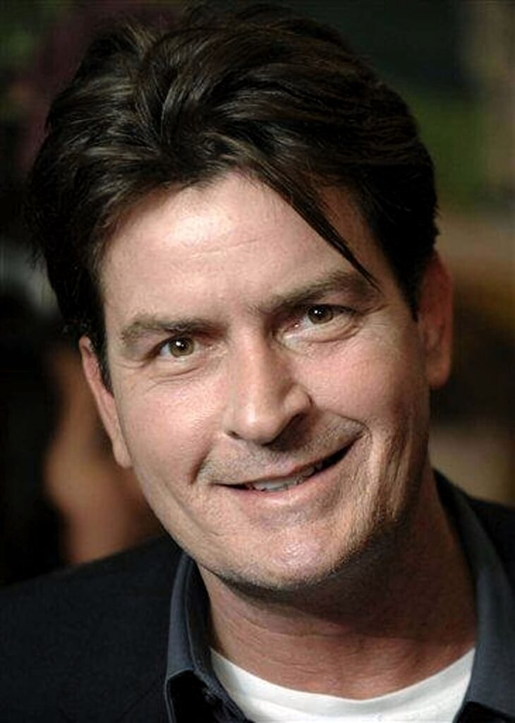 Charlie Sheen close-up portrait warm tones expressive smile natural light wallpaper background