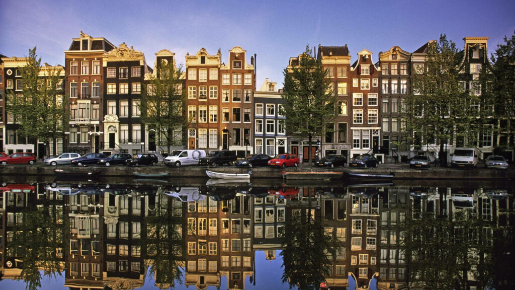 Charming Amsterdam Canal Houses Wallpaper: Unique Architecture Reflection