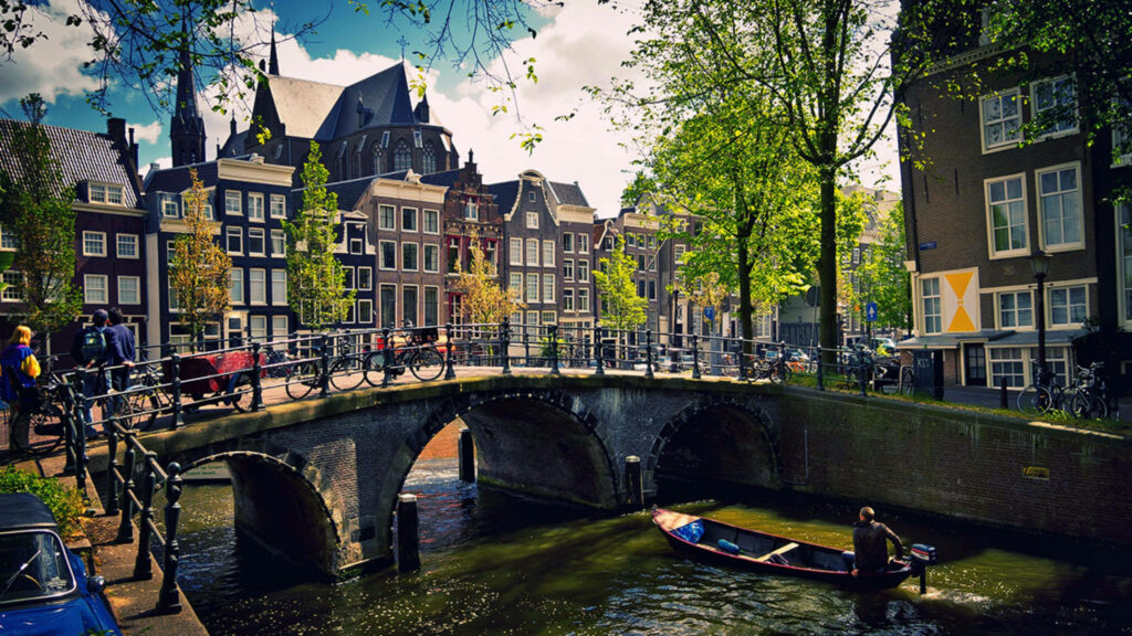 Charming Amsterdam Canal: Scenic Wallpaper of Bridges & Dutch Architecture
