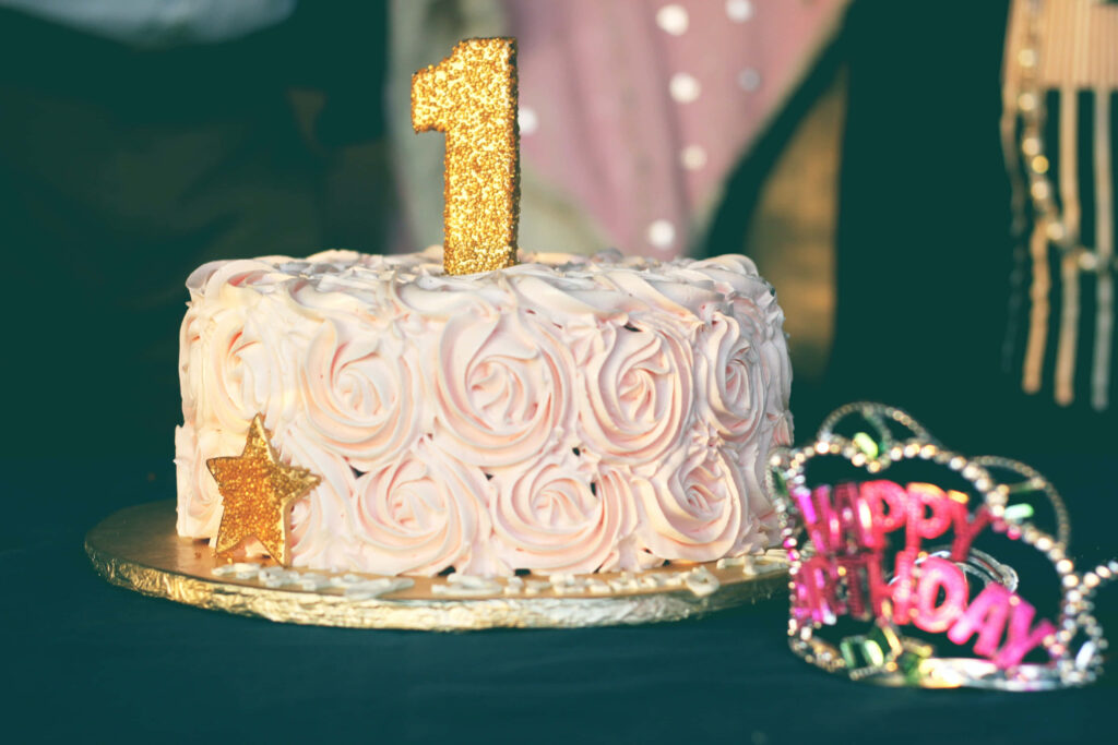 Charming Birthday Wallpaper: Pink Rosette Cake & Festive Tiara