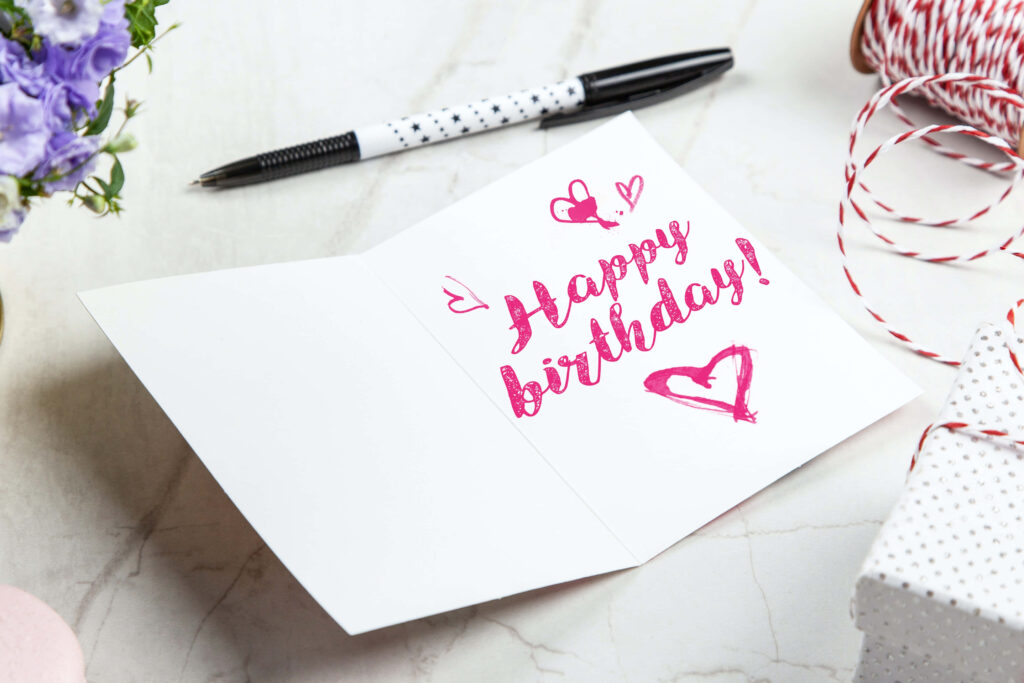 Charming Birthday Scene: Vibrant Card, Gift, and Festive Decor Wallpaper