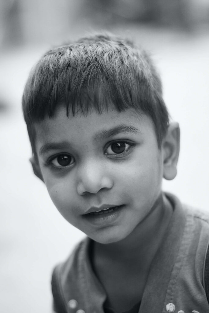 Innocent Child Portrait: Black & White Wallpaper with Gentle Gaze