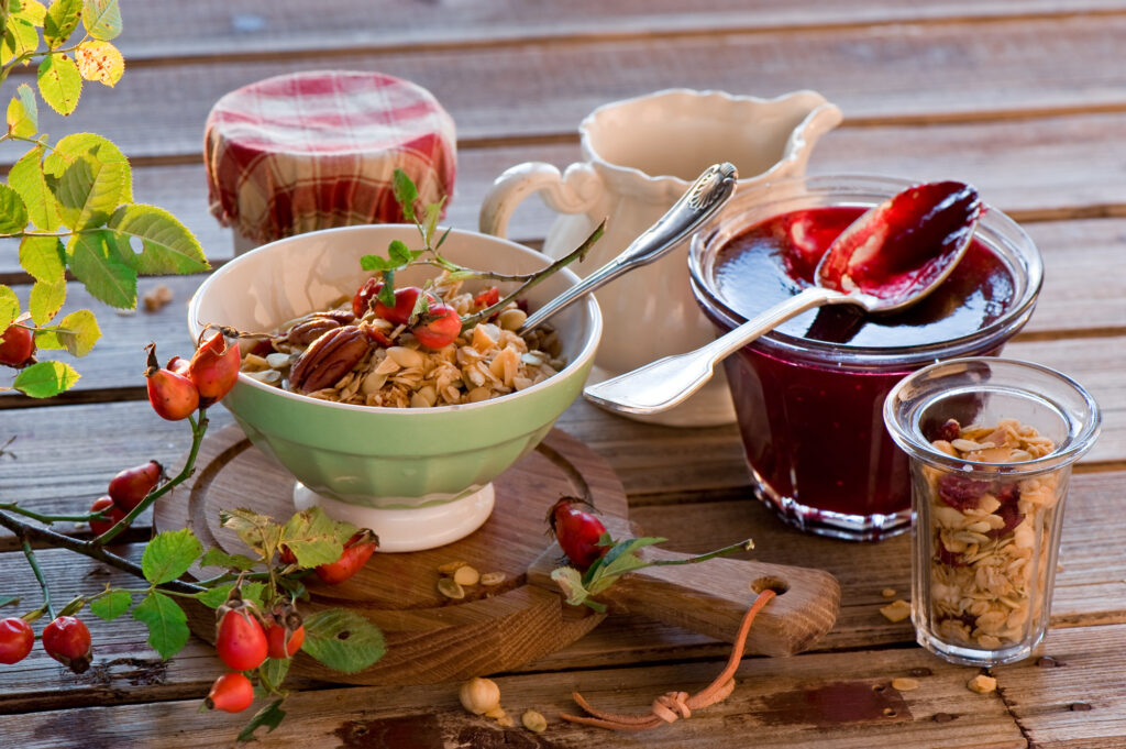 Charming Breakfast Still Life: Muesli, Jam, and Rustic Decor Wallpaper