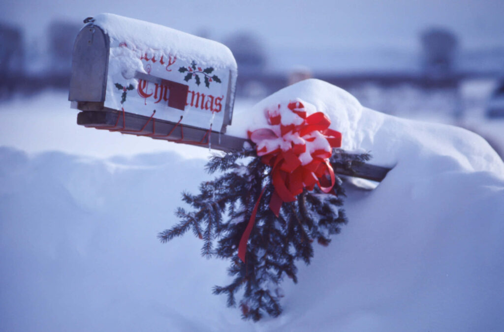 Charming Christmas Mailbox in Snowy Winter Scene Wallpaper