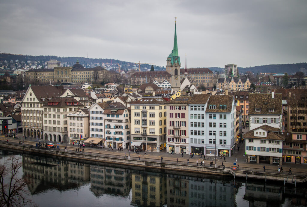 Scenic Cityscape Wallpaper: Colorful Riverfront with Charming Architecture