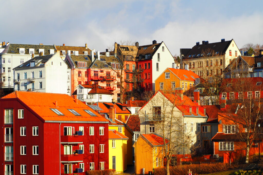 Charming Cityscape Wallpaper: Colorful Buildings & Autumn Trees