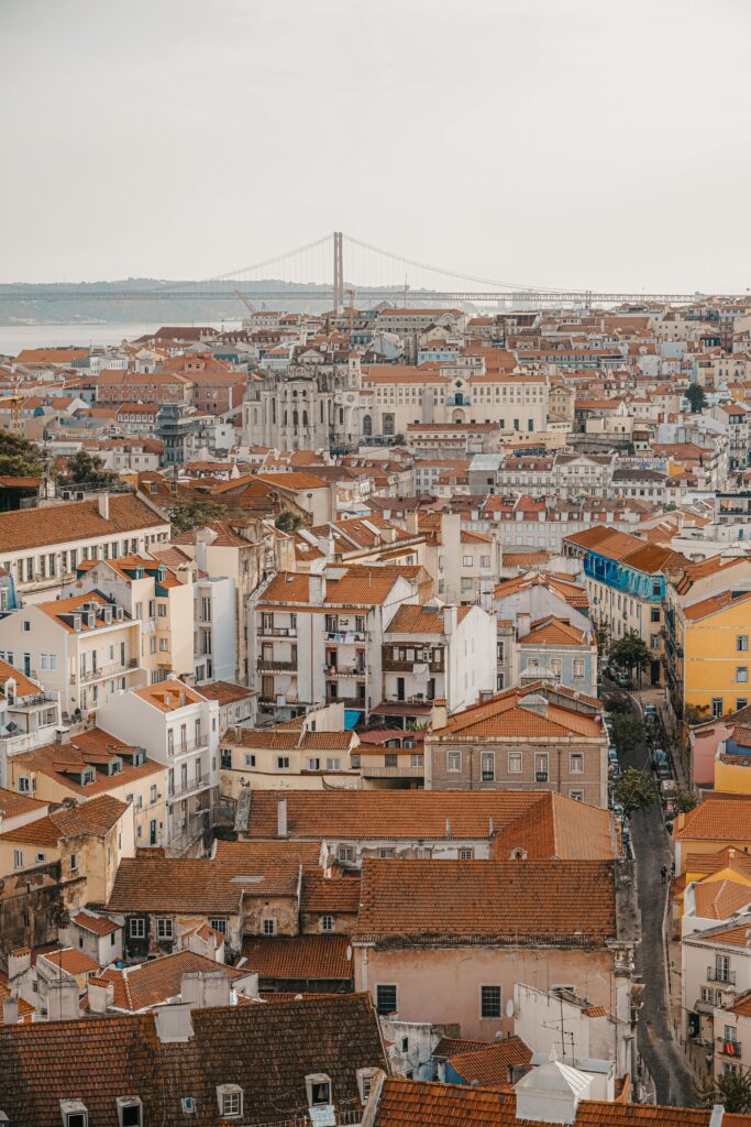 Charming Cityscape Wallpaper: Red-Tiled Roofs & Elegant Architecture
