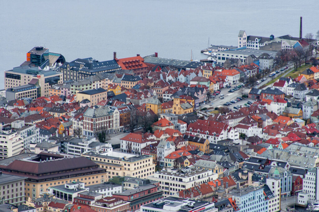 Charming Coastal Cityscape Wallpaper: Colorful Homes & Serene Waterfront