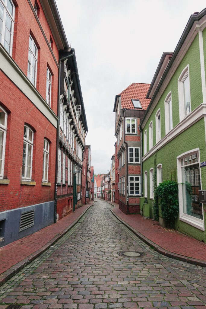 Charming Cobblestone Street Wallpaper: Historic Buildings & Vibrant Facades