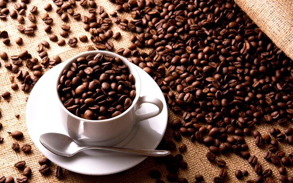 Stylish Coffee Cup Wallpaper: Beans on Burlap Background