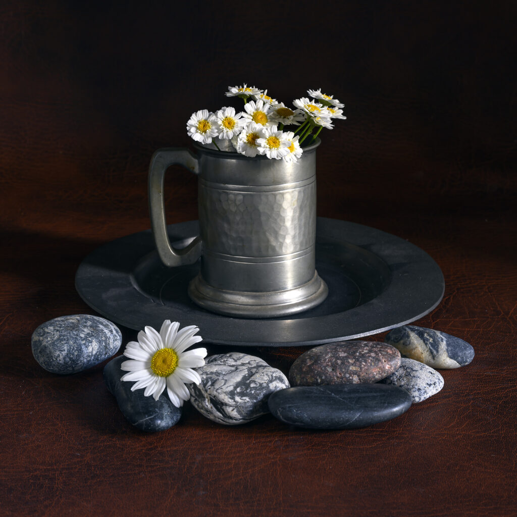 Charming Daisies in Rustic Mug with Stones - Serene Background Wallpaper
