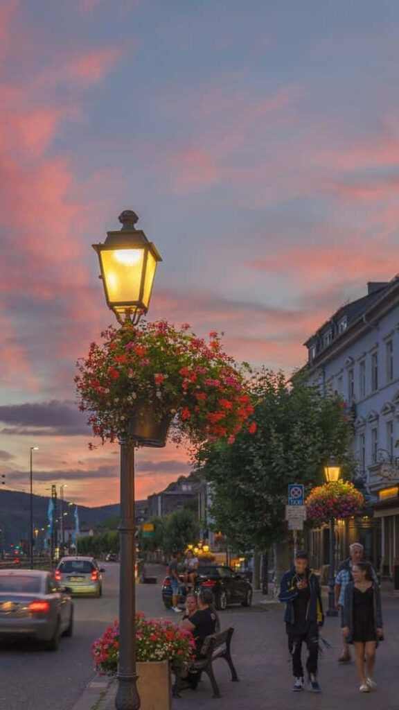 Charming European Street Scene with Flower Lamp Post at Sunset - Wallpaper