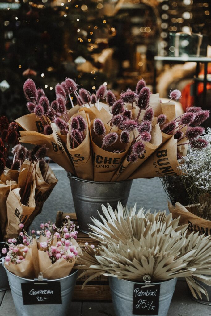 Charming Floral Arrangements: Vibrant Purple Bouquets in Rustic Decor Wallpaper