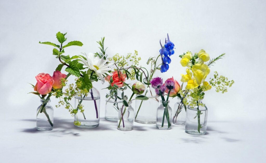 Charming Floral Wallpaper: Roses, Chamomile & Bluebells in Jars