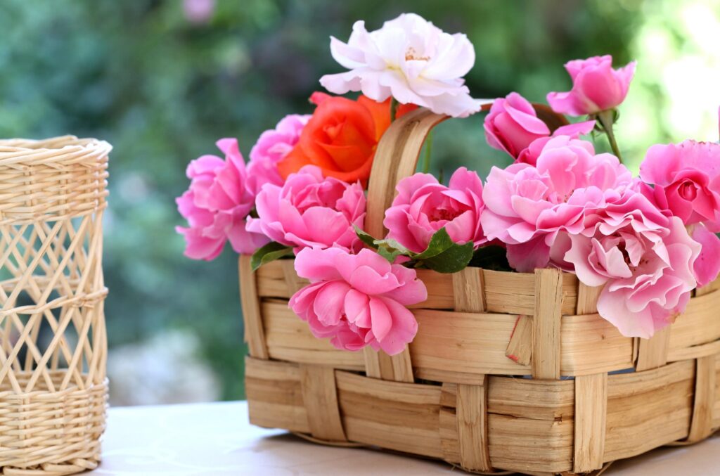 Charming Wicker Basket with Pink & Orange Roses - Serene Garden Wallpaper