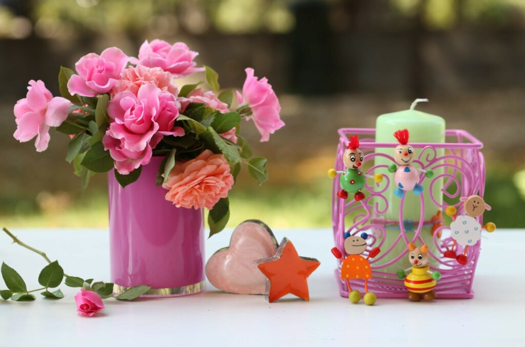 Charming Pink Vase with Flowers and Whimsical Decor in Soft Background Wallpaper