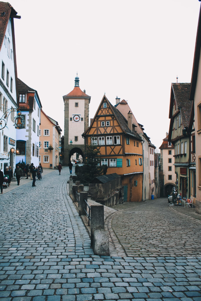 Charming Germany Street View Wallpaper: Pastel Houses & Cobblestone Paths