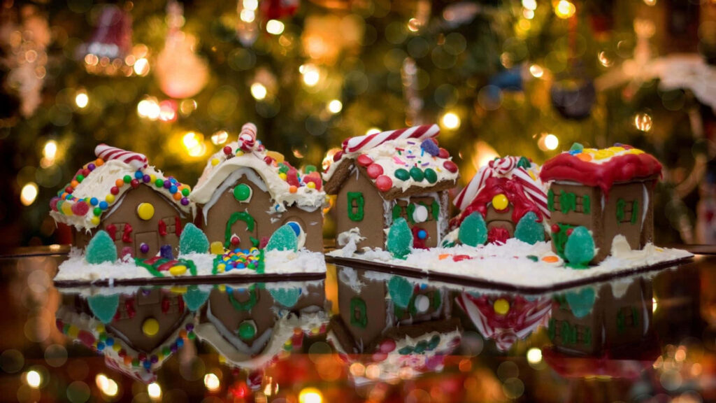 Charming Gingerbread Village Wallpaper with Twinkling Holiday Lights