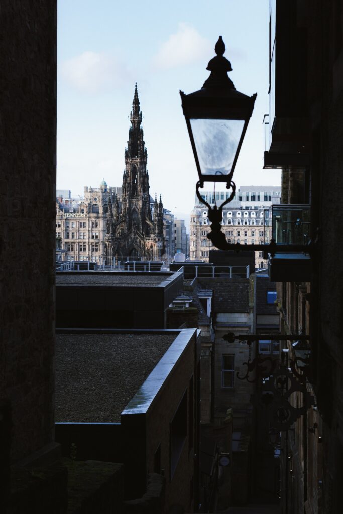 Vintage Cityscape Wallpaper: Gothic Spire & Historic Architecture