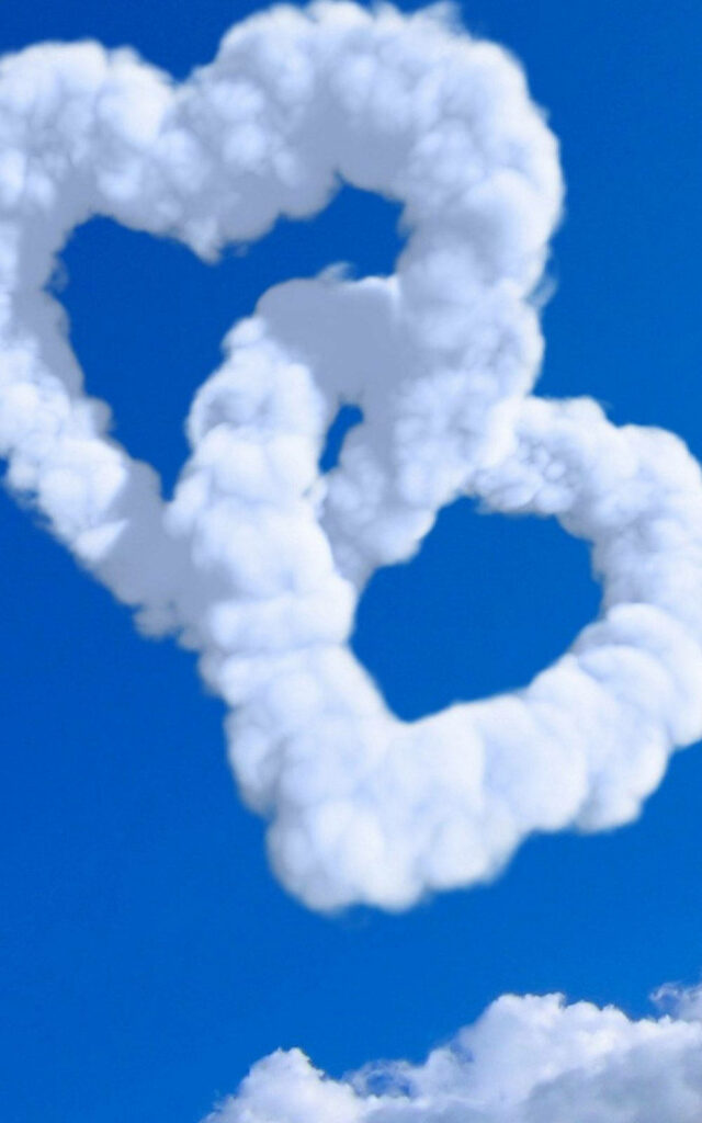 Charming Heart-Shaped Clouds Wallpaper in a Bright Blue Sky