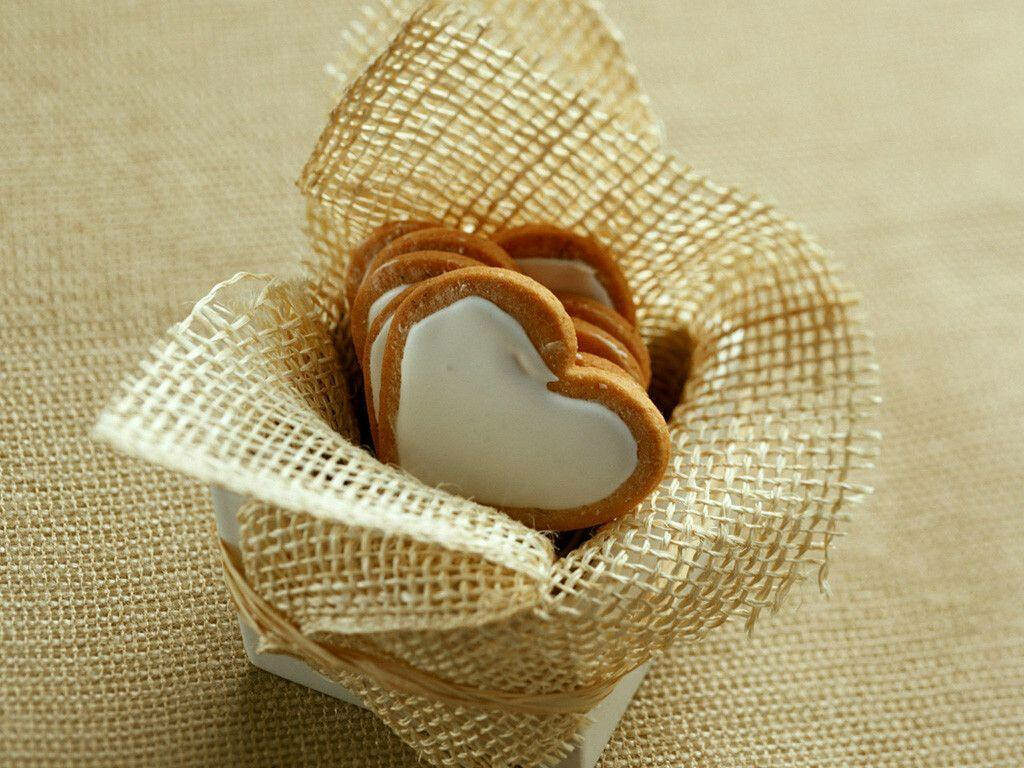 Charming Heart-Shaped Cookie Wallpaper in Rustic Basket