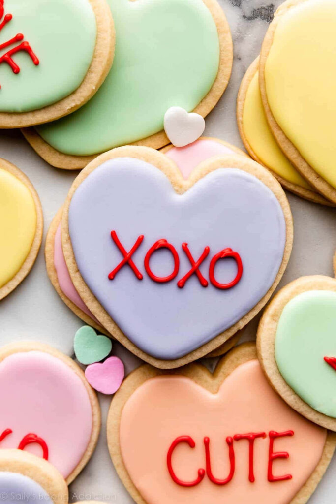 Charming Heart-Shaped Cookies: Pastel Icing & Valentine's Day Decor Wallpaper