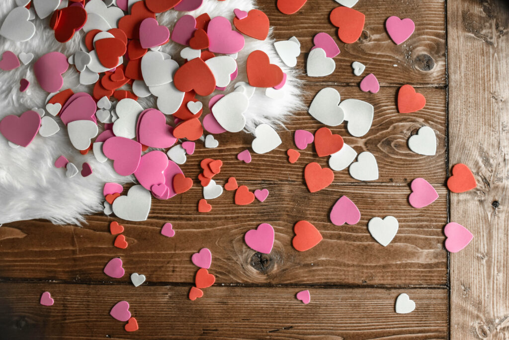 Romantic Heart-Shaped Cutouts Wallpaper on Rustic Wood - iPhone Background