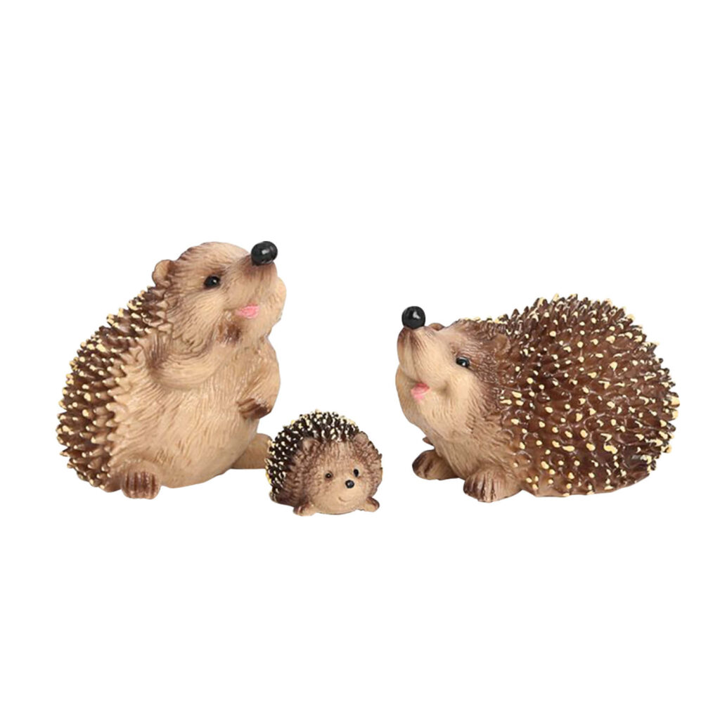 Charming Hedgehog Family Toy Collection on White Background Wallpaper