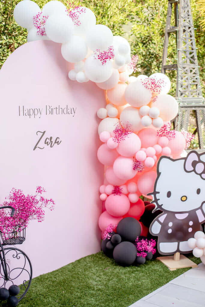 Charming Hello Kitty Birthday Wallpaper with Pastel Pink Backdrop