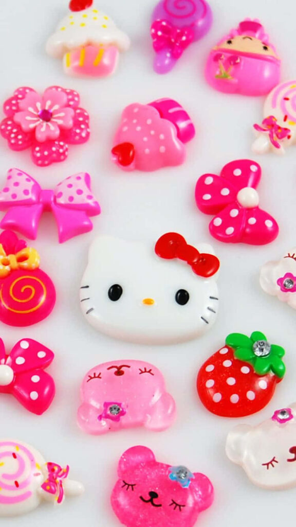 Whimsical Hello Kitty Wallpaper: Cute Icons on Pink Background