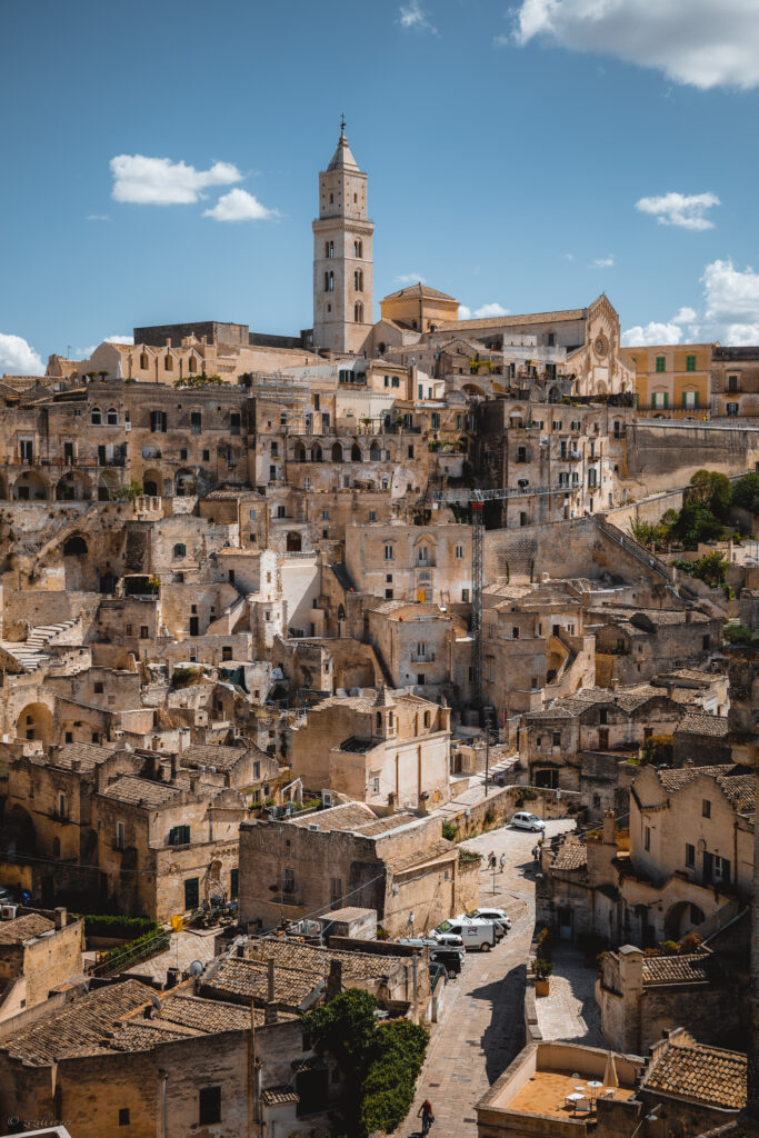 Charming Historic Cityscape Wallpaper with Rustic Architecture & Tower