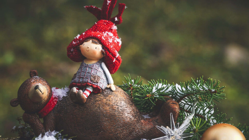 Charming Holiday Wallpaper: Child, Bear, Snow, and Christmas Cheer