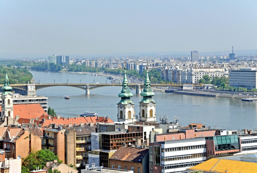 Charming Hungary Cityscape Wallpaper: Red Rooftops & Serene River