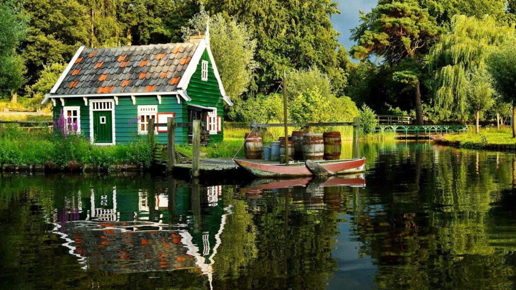 Charming Green Cottage by Serene Lake: Rustic Wallpaper Background