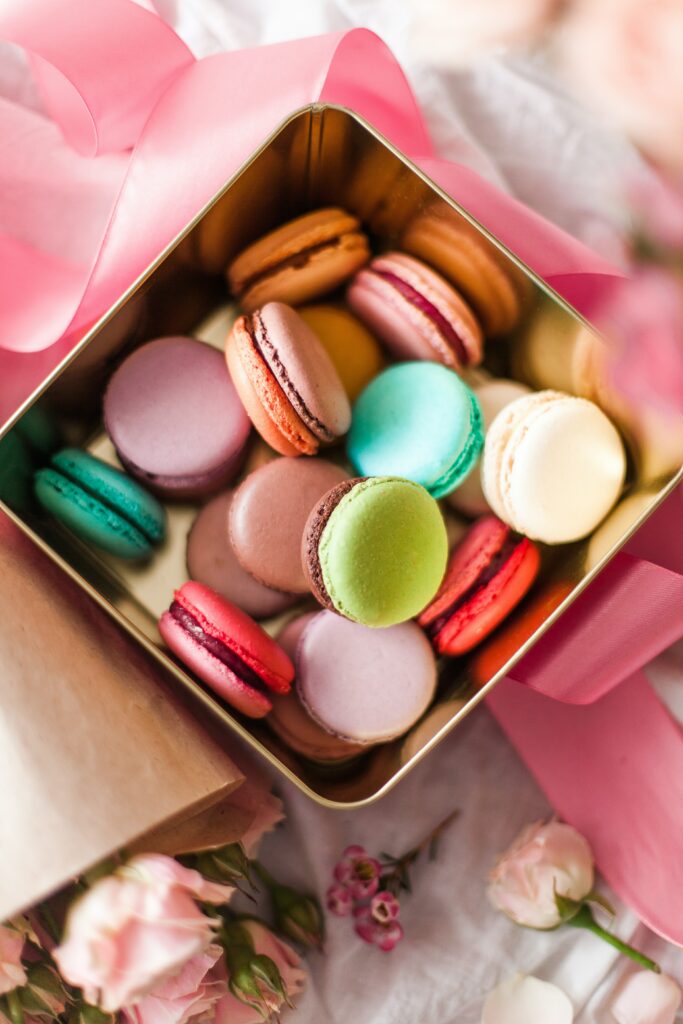 Charming Macarons Wallpaper: Colorful Treats & Floral Elegance