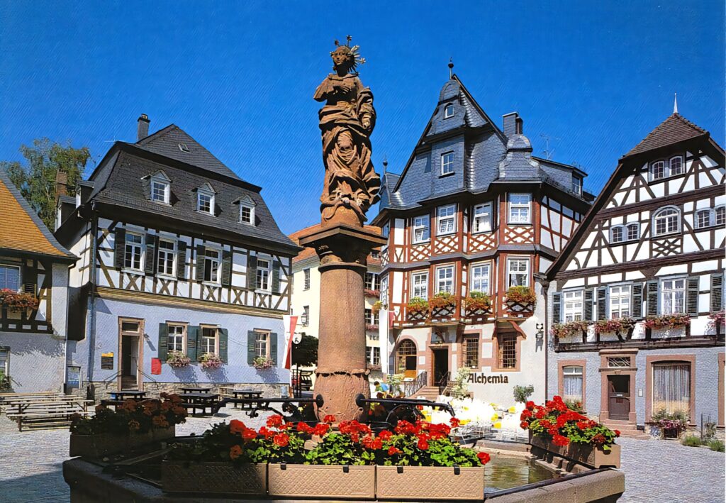 Charming Oberstdorf Village: Half-Timbered Houses & Vibrant Flowers Wallpaper